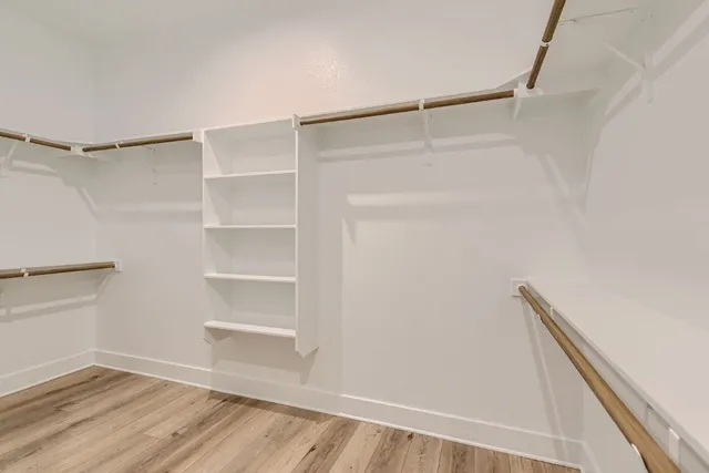 a view of an empty walk in closet