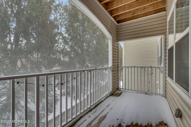 a view of a balcony with wooden floor