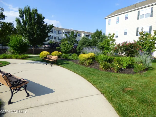 a view of a backyard with sitting area