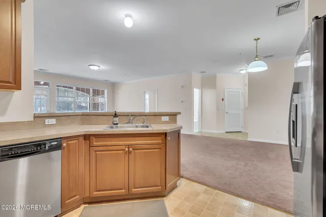 a kitchen with a sink and cabinets