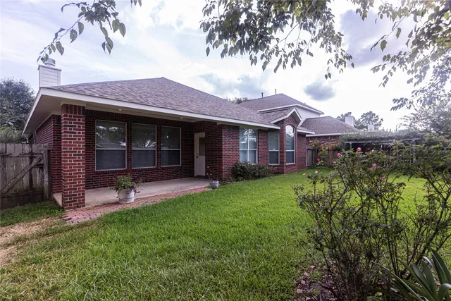 a backyard of a house with lots of green space
