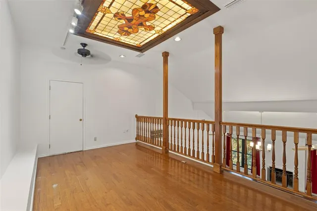a bathroom with a bathtub shower sink vanity and toilet