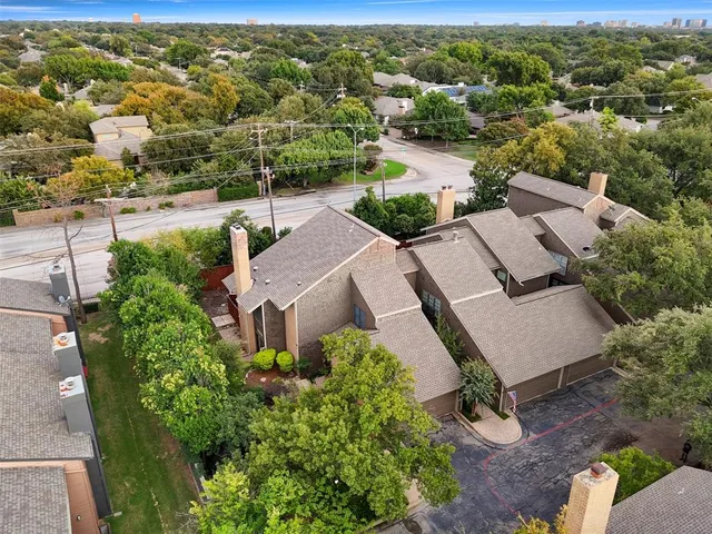 an aerial view of a house with a lake view