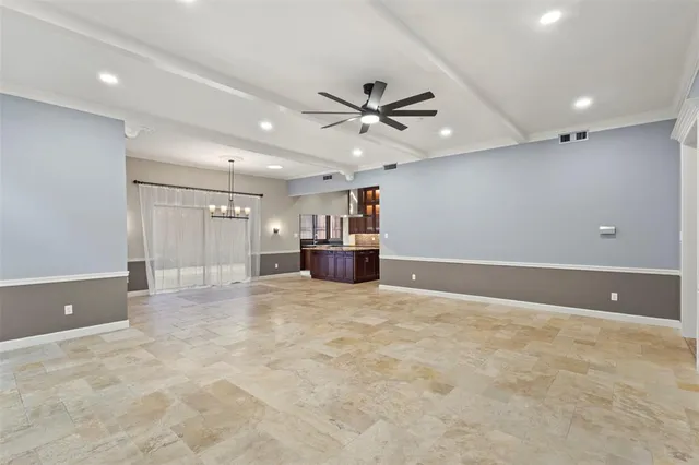 a view of a livingroom with a kitchen