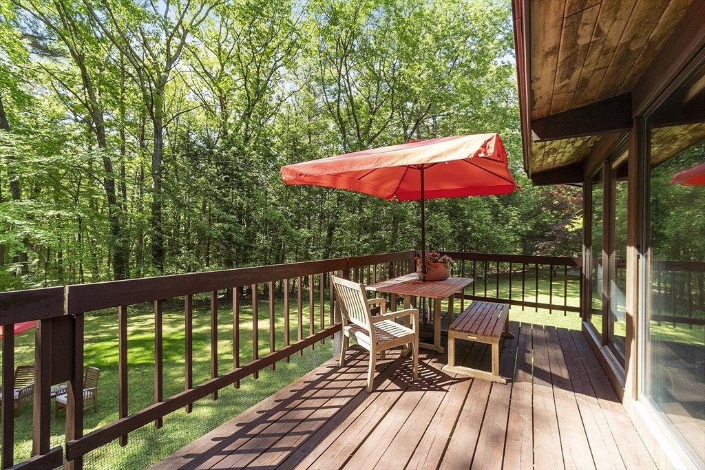 157 Carleton Road Carlisle, MA 01741 - Photo 11 of 42 a view of balcony with wooden floor and outdoor seating