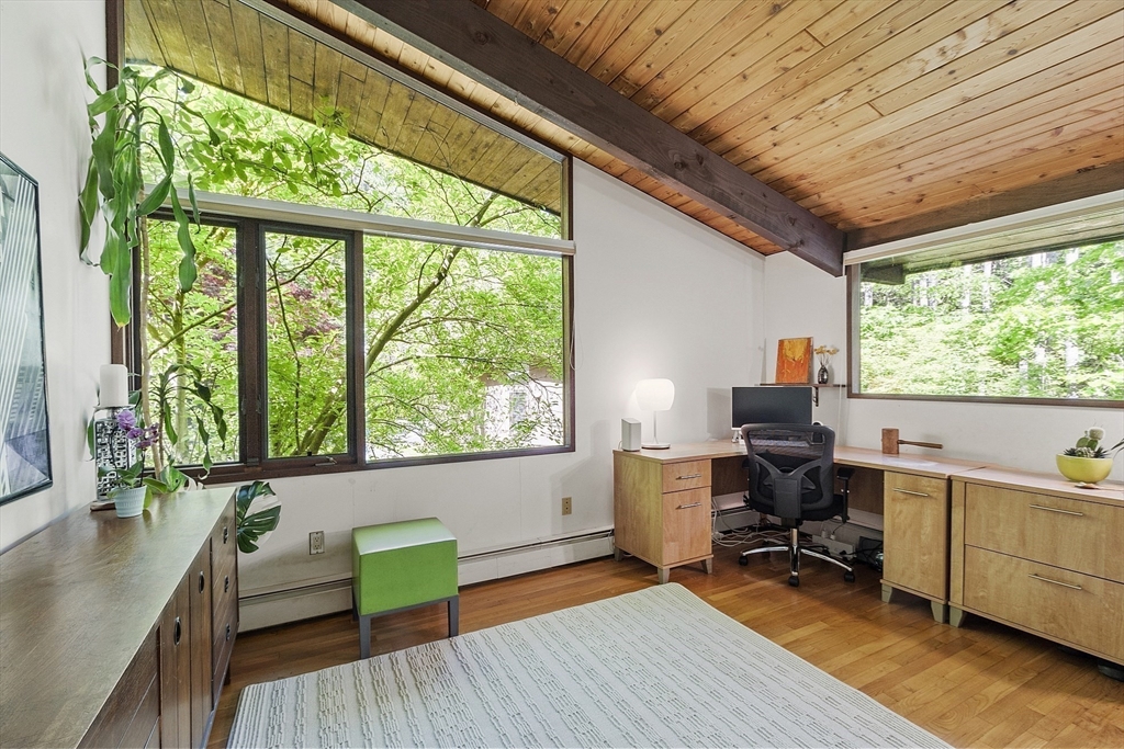 157 Carleton Road Carlisle, MA 01741 - Photo 19 of 42 a view of a workspace with furniture and a window