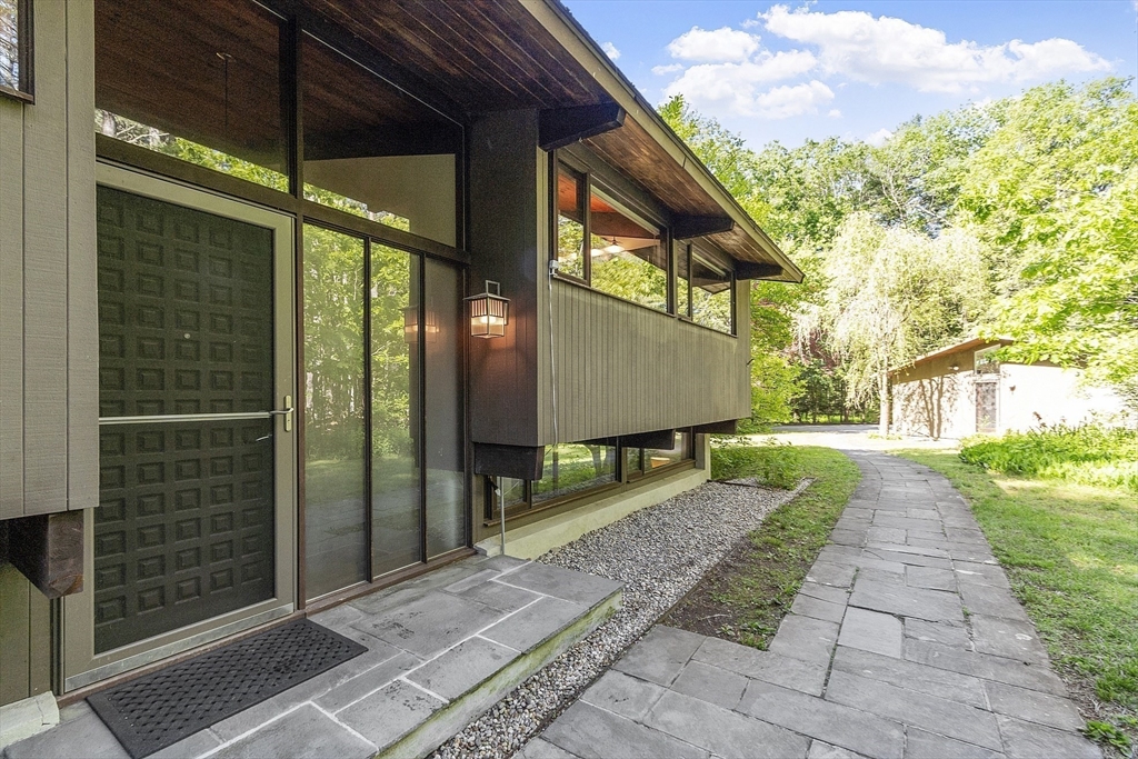 157 Carleton Road Carlisle, MA 01741 - Photo 3 of 42 a view of a street with brick walls