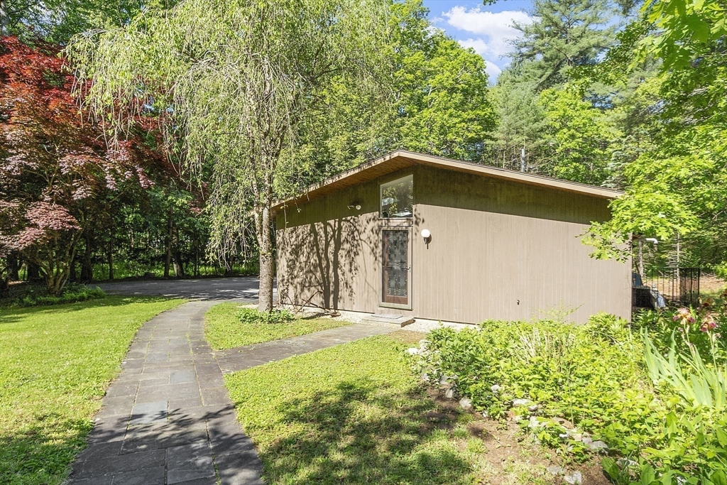 157 Carleton Road Carlisle, MA 01741 - Photo 33 of 42 a front view of a house with garden