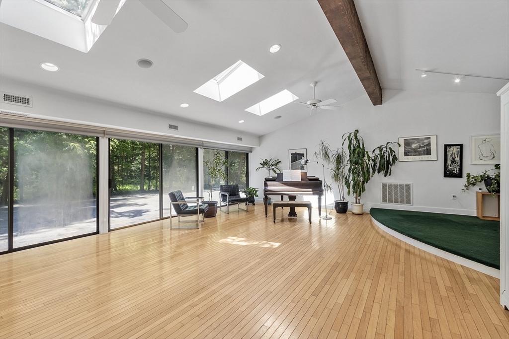 157 Carleton Road Carlisle, MA 01741 - Photo 34 of 42 a living room with furniture and a wooden floor
