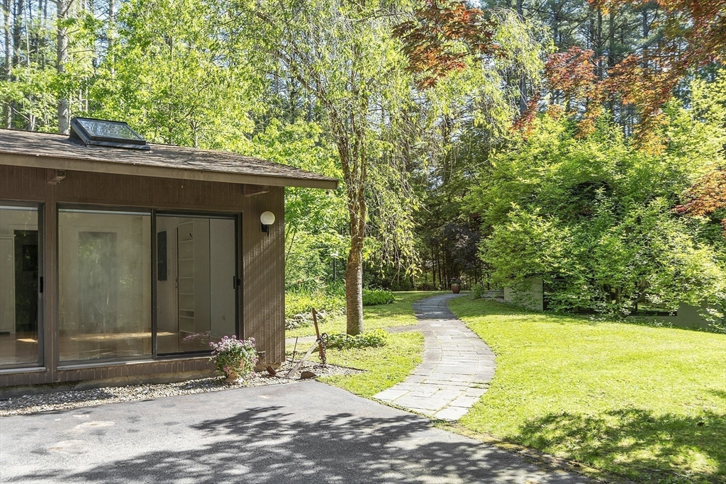 157 Carleton Road Carlisle, MA 01741 - Photo 38 of 42 a view of a house with backyard and trees