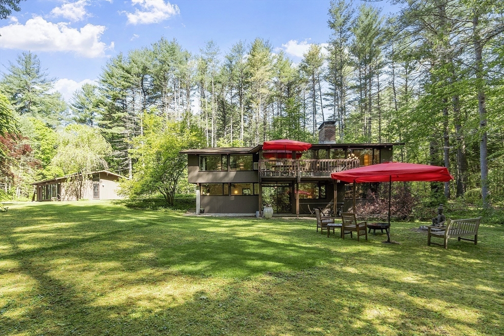 157 Carleton Road Carlisle, MA 01741 - Photo 39 of 42 a view of a house with backyard and sitting area