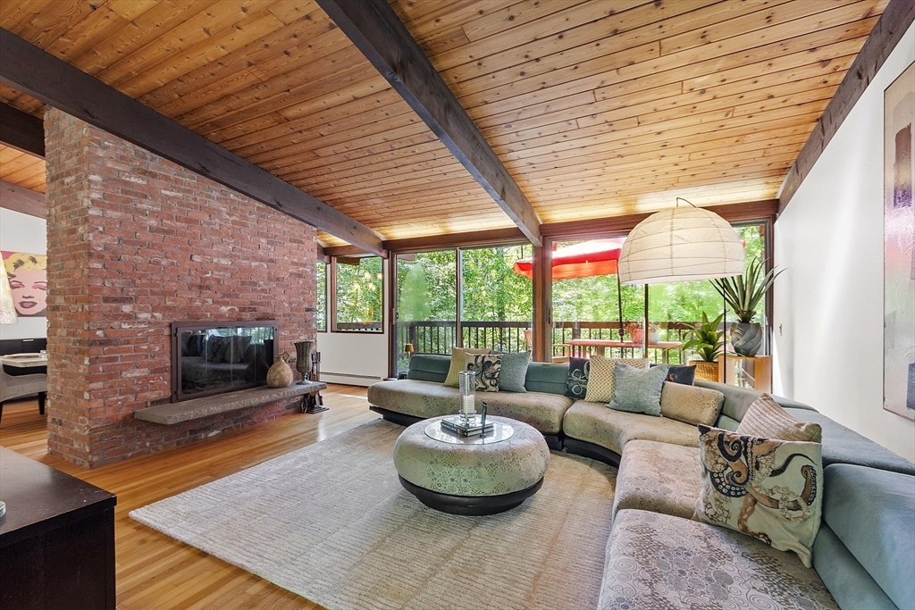 157 Carleton Road Carlisle, MA 01741 - Photo 6 of 42 a living room with furniture and a flat screen tv
