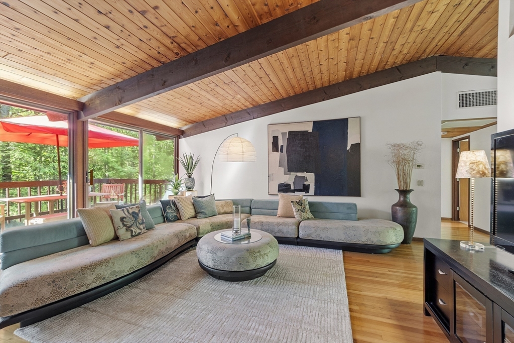 157 Carleton Road Carlisle, MA 01741 - Photo 8 of 42 a living room with furniture and a large window