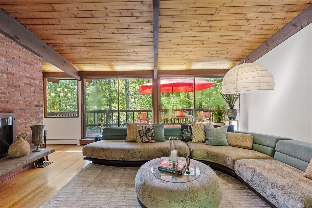 157 Carleton Road Carlisle, MA 01741 - Photo 9 of 42 a living room with furniture and a large window