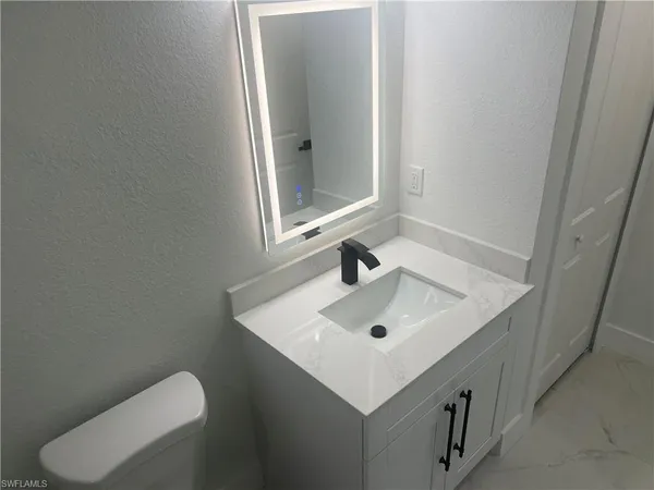 a bathroom with a sink and a toilet