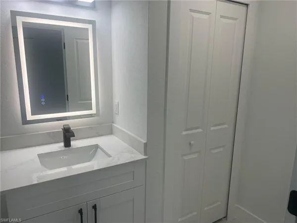 a bathroom with a sink and a mirror