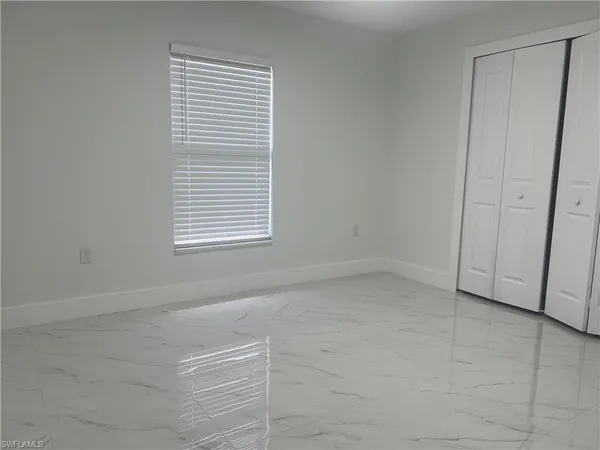 a view of a room that has a window in it