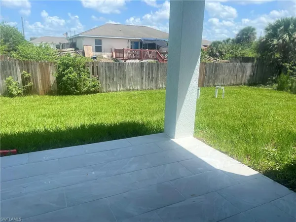 a view of backyard with green space