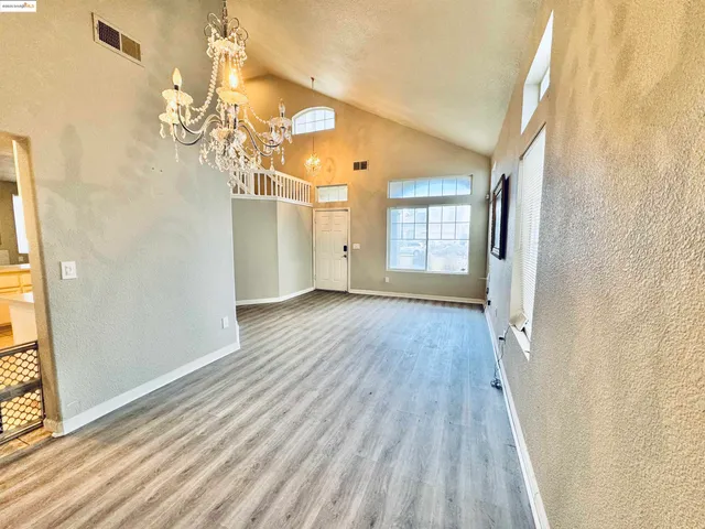 a kitchen with stainless steel appliances a refrigerator sink and cabinets