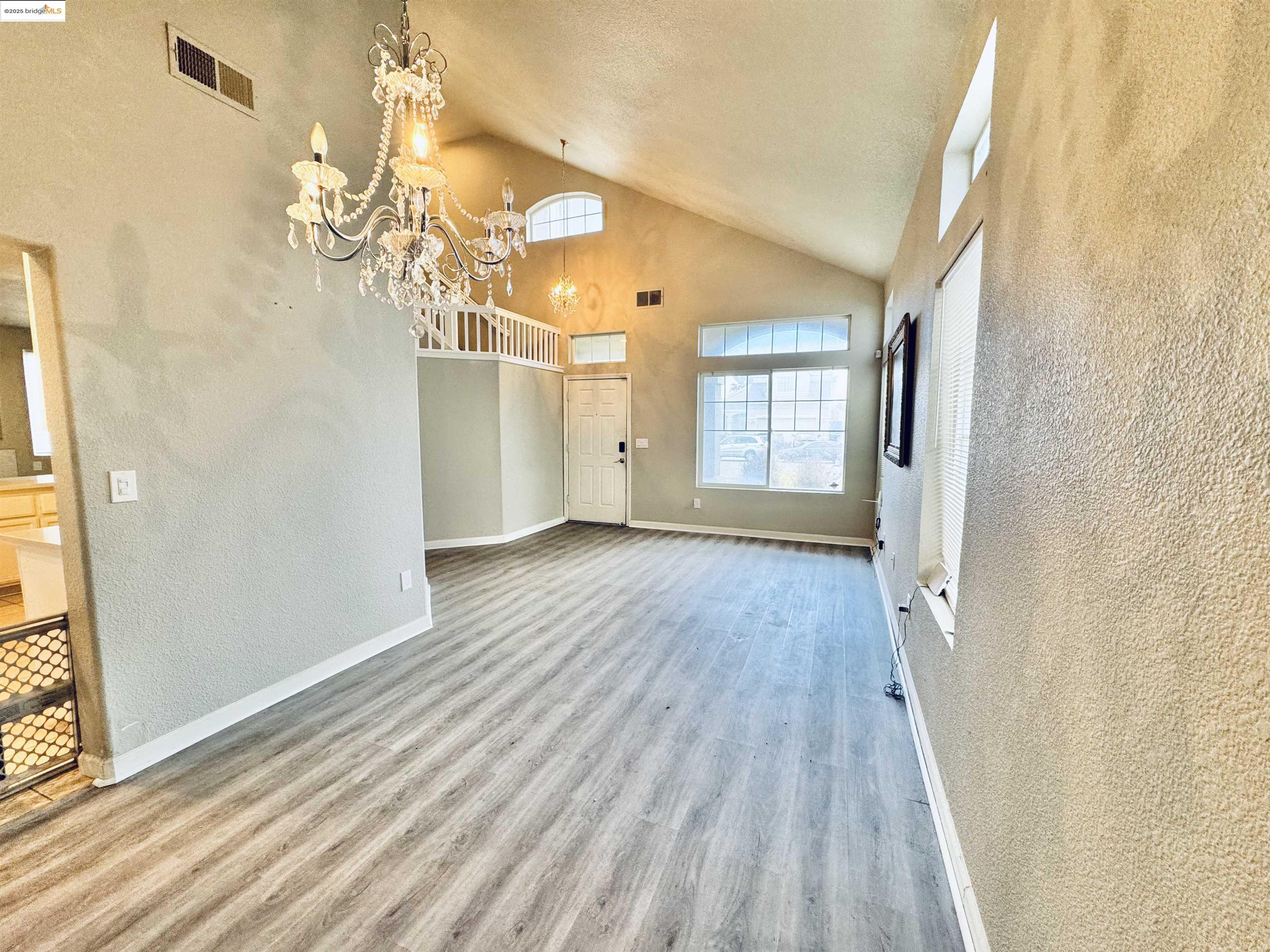 756 Rubier Way Rio Vista, CA 94571 - Photo 4 of 20 wooden floor in an empty room with a window