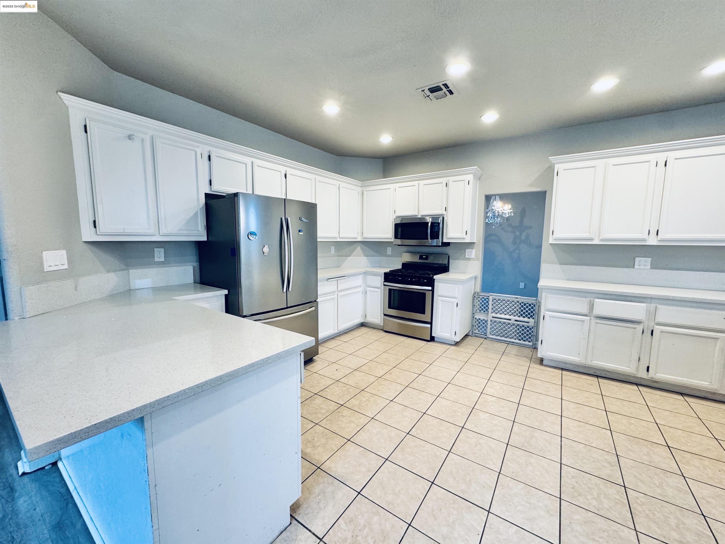756 Rubier Way Rio Vista, CA 94571 - Photo 5 of 20 a kitchen with stainless steel appliances a refrigerator sink and cabinets