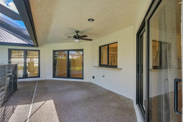 a view of a hallway with windows