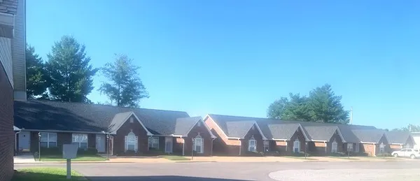 a view of house next to a yard