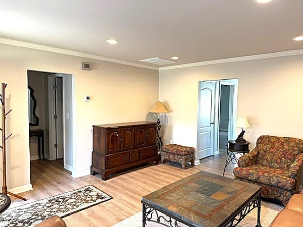 a bedroom with a bed and dresser
