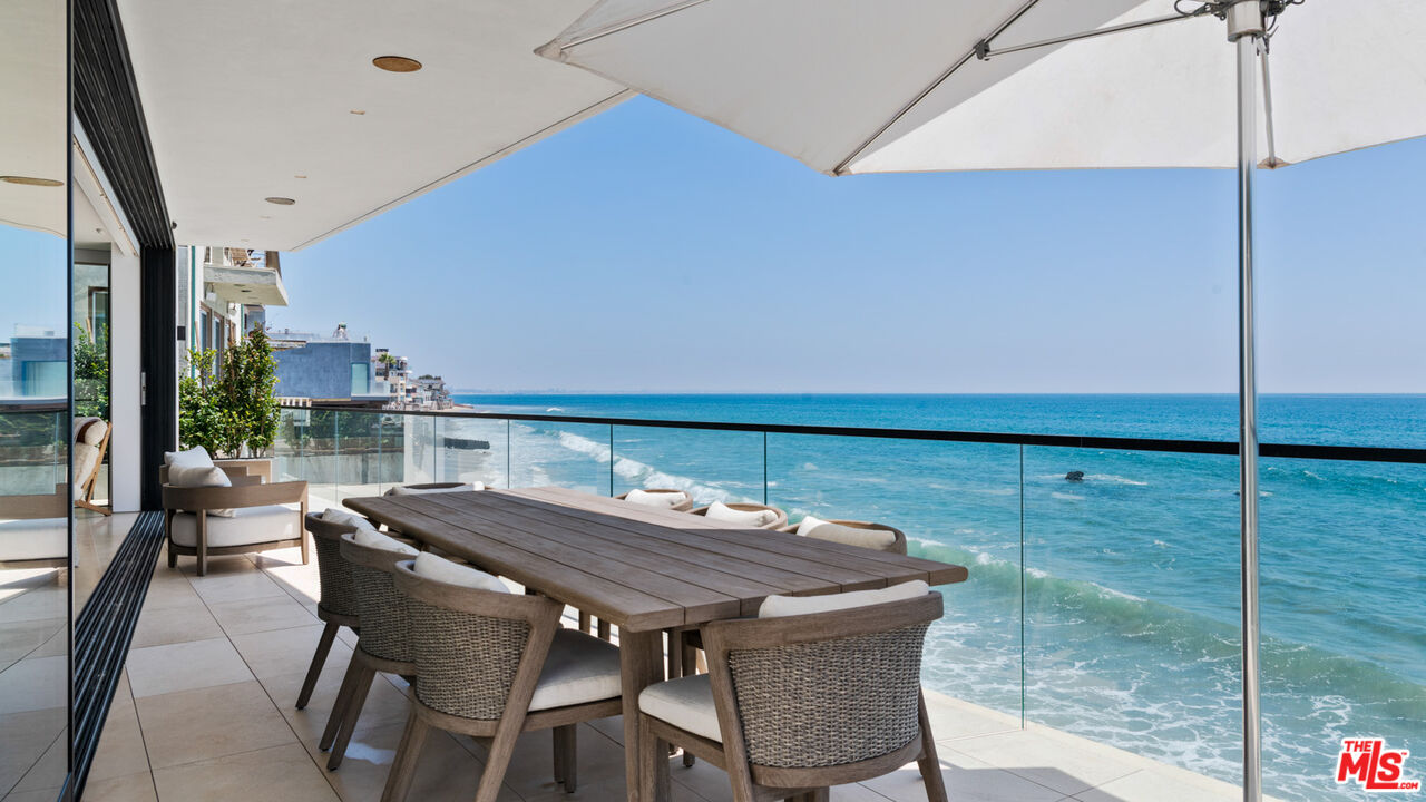 18954 Pacific Coast Highway Malibu, CA 90265 - Photo 18 of 70 a view of a dining room with furniture window and wooden floor