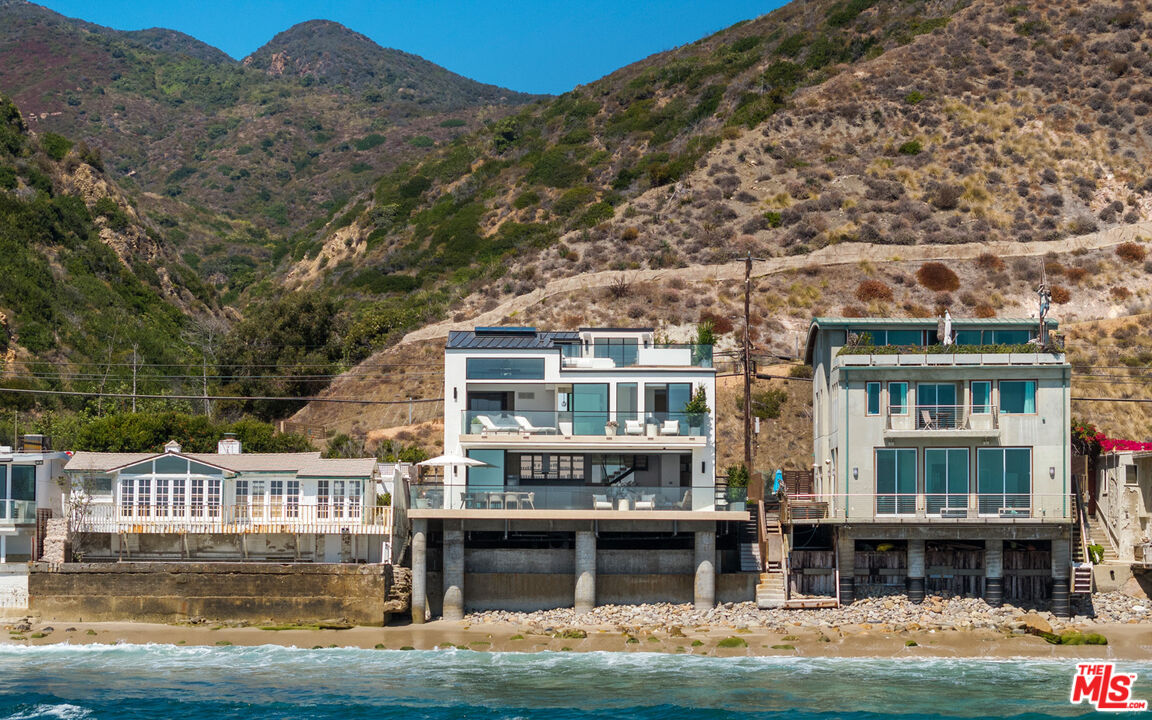 18954 Pacific Coast Highway Malibu, CA 90265 - Photo 2 of 70 a front view of a house with a boat