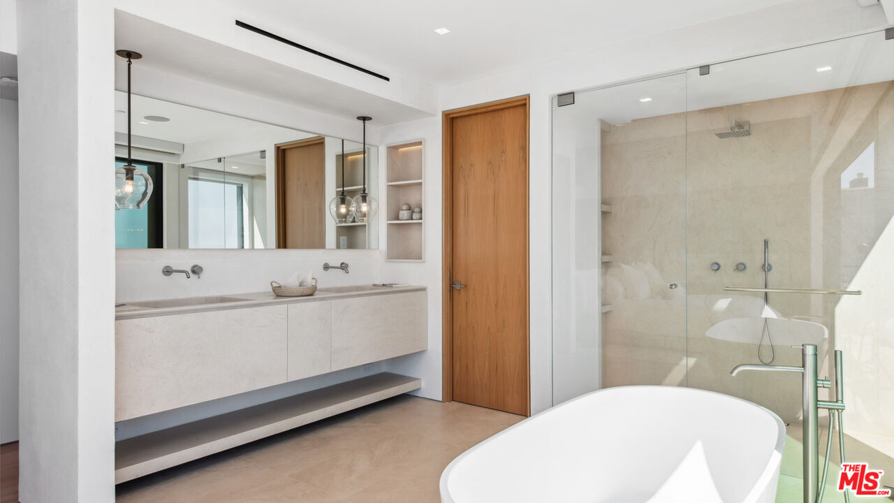 18954 Pacific Coast Highway Malibu, CA 90265 - Photo 27 of 70 a bathroom with a sink a toilet and shower