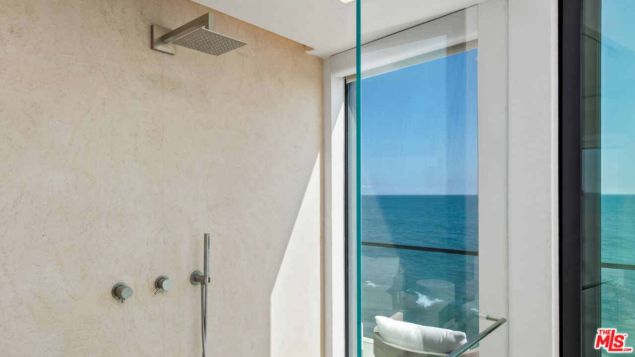 18954 Pacific Coast Highway Malibu, CA 90265 - Photo 30 of 70 a bathroom with a glass shower door