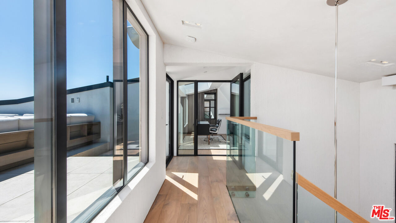 18954 Pacific Coast Highway Malibu, CA 90265 - Photo 38 of 70 a view of a hallway with a livingroom and furniture
