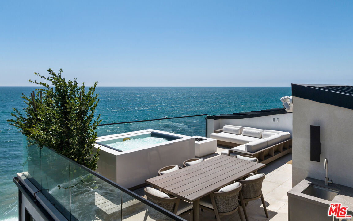 18954 Pacific Coast Highway Malibu, CA 90265 - Photo 47 of 70 an aerial view of a house with outdoor space and a lake view in back