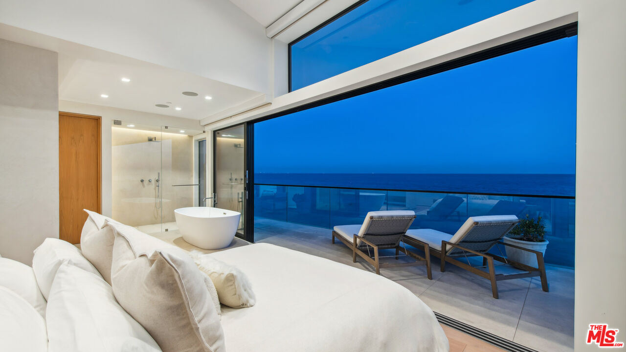 18954 Pacific Coast Highway Malibu, CA 90265 - Photo 65 of 70 a dining room with furniture and wooden floor