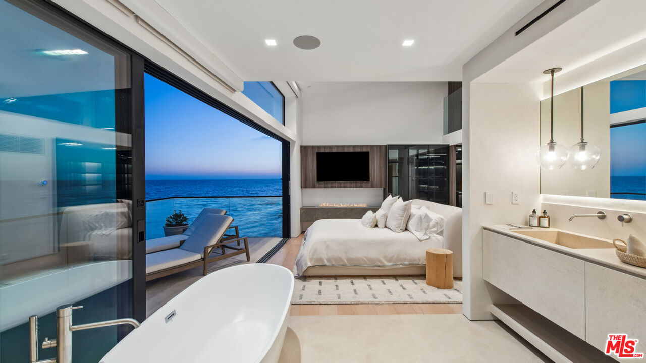 18954 Pacific Coast Highway Malibu, CA 90265 - Photo 67 of 70 a living room with furniture and a large window