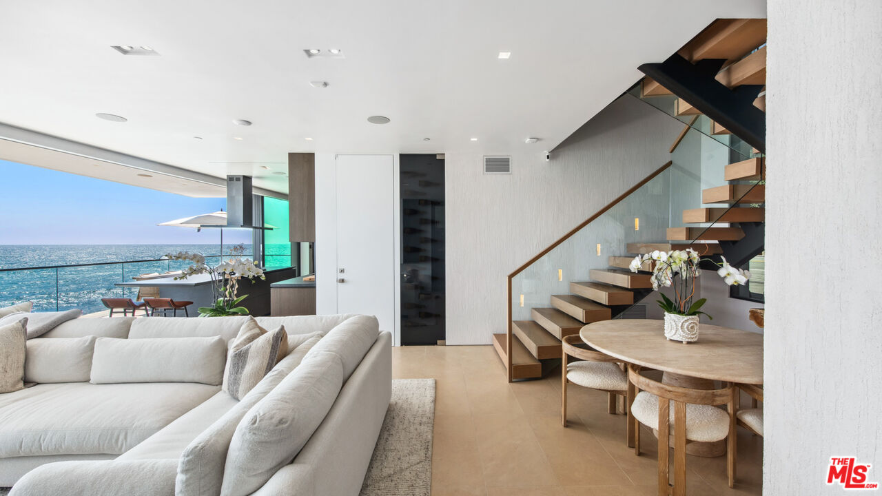 18954 Pacific Coast Highway Malibu, CA 90265 - Photo 7 of 70 a living room with furniture and wooden floor