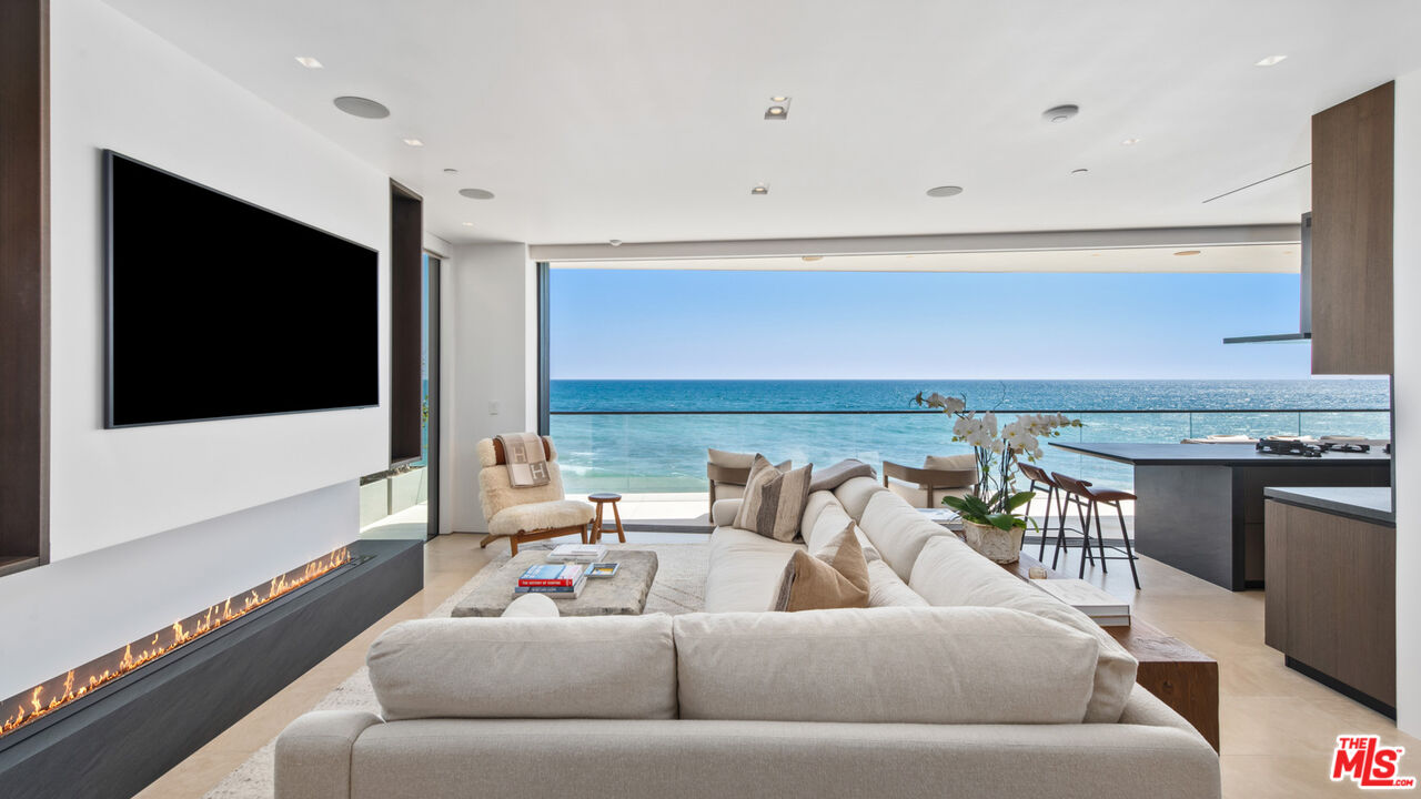 18954 Pacific Coast Highway Malibu, CA 90265 - Photo 8 of 70 a living room with furniture and a flat screen tv