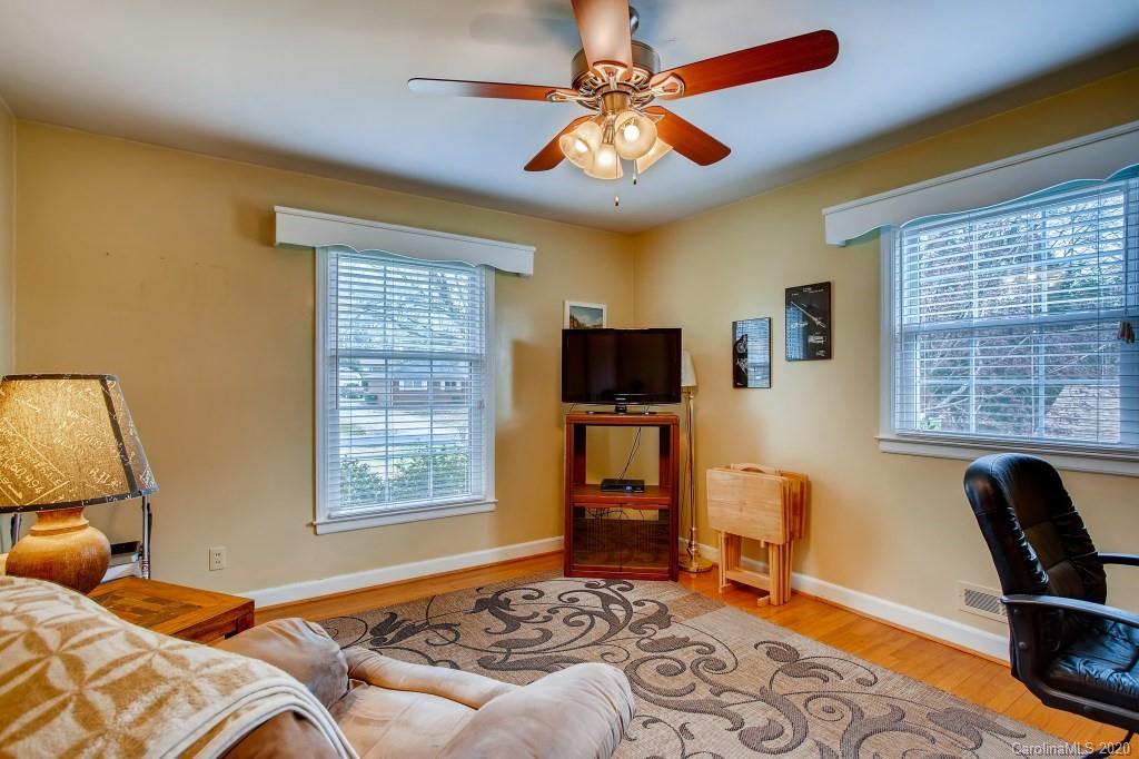 4921 Cheviot Road Charlotte, NC 28269 - Photo 21 of 28 a bedroom with furniture and a window