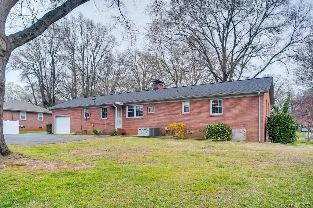 4921 Cheviot Road Charlotte, NC 28269 - Photo 26 of 28 a view of a house with a yard