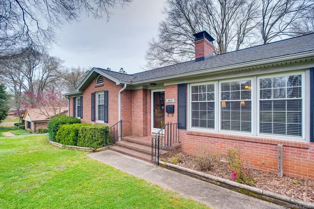4921 Cheviot Road Charlotte, NC 28269 - Photo 4 of 28 a front view of a house with garden