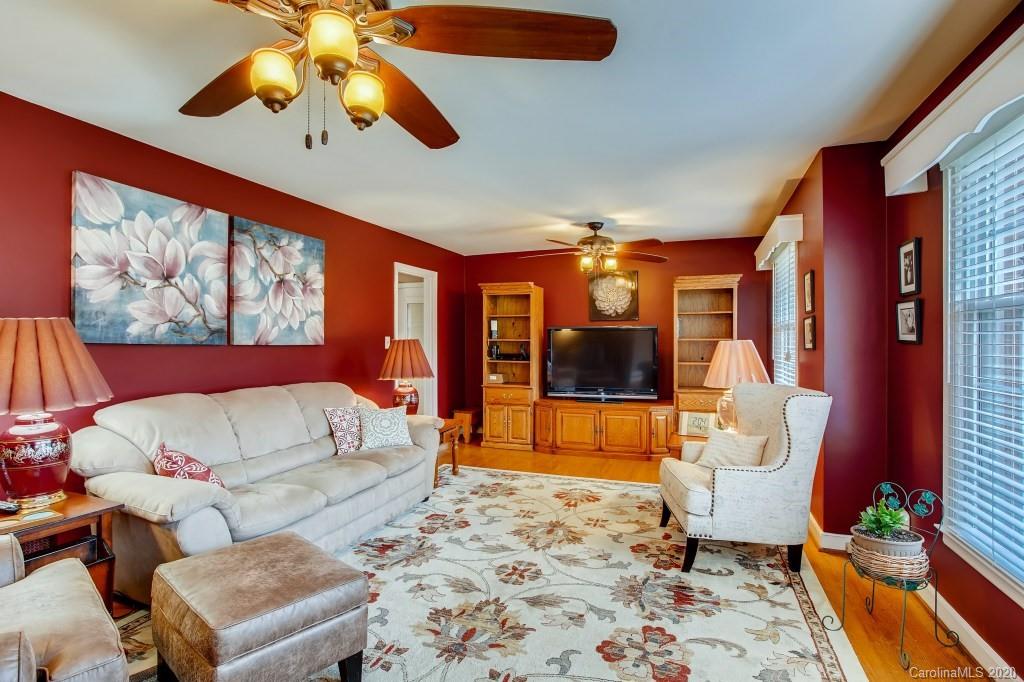 4921 Cheviot Road Charlotte, NC 28269 - Photo 6 of 28 a living room with furniture and a flat screen tv