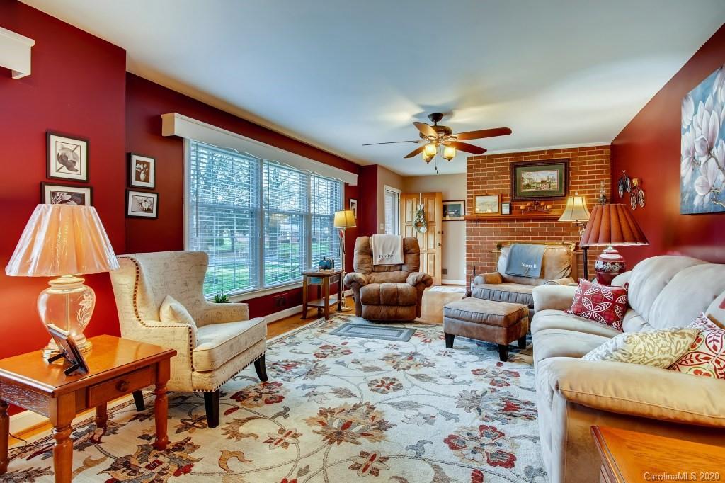 4921 Cheviot Road Charlotte, NC 28269 - Photo 7 of 28 a living room with patio furniture and a large window