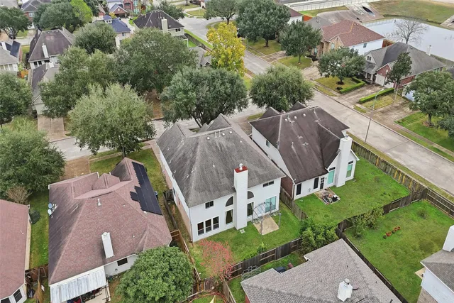 an aerial view of a house with outdoor space