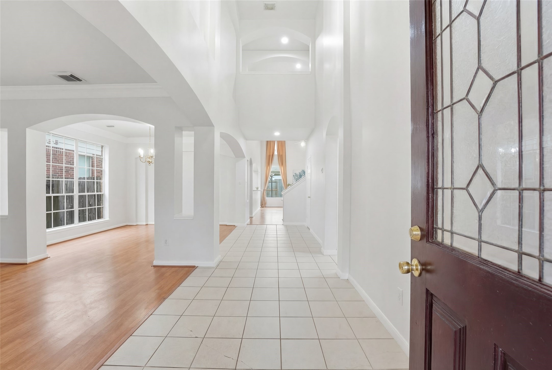 8522 Chickamauga Lane Houston, TX 77083 - Photo 4 of 33 a view of a hallway with wooden floor and a bathroom
