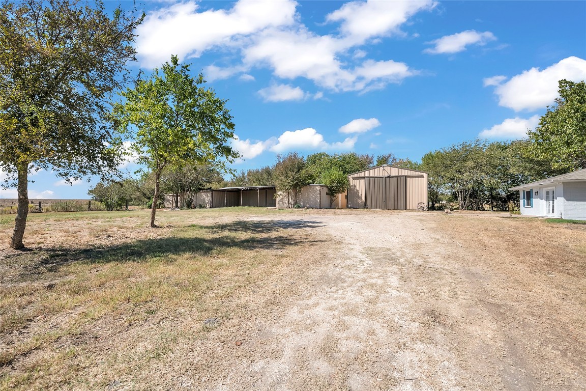310 Hruskaville Road Temple, TX 76501 - Photo 2 of 21 View of yard featuring an outbuilding