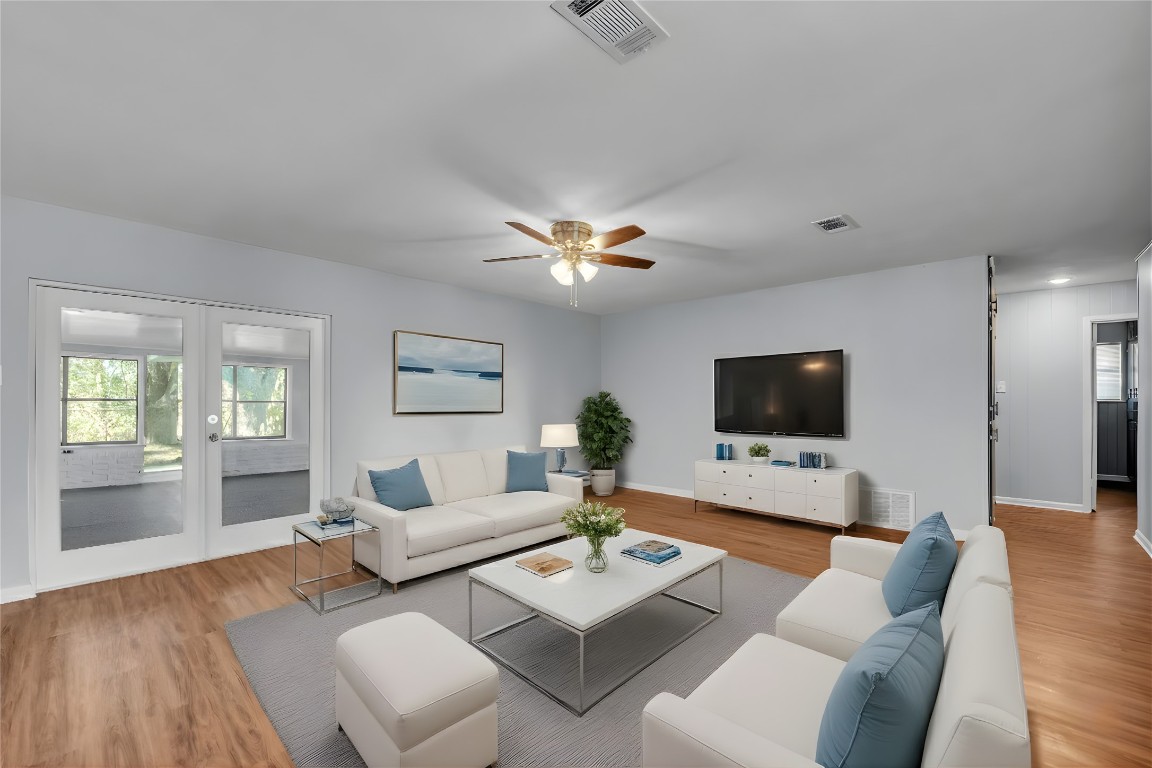 310 Hruskaville Road Temple, TX 76501 - Photo 9 of 21 Living room featuring french doors and light wood finished floors