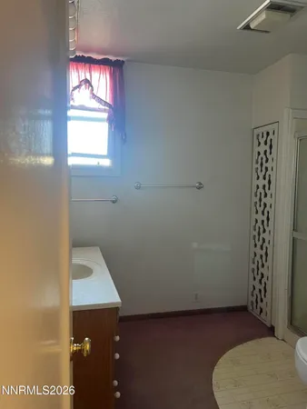 a view of an empty room and window