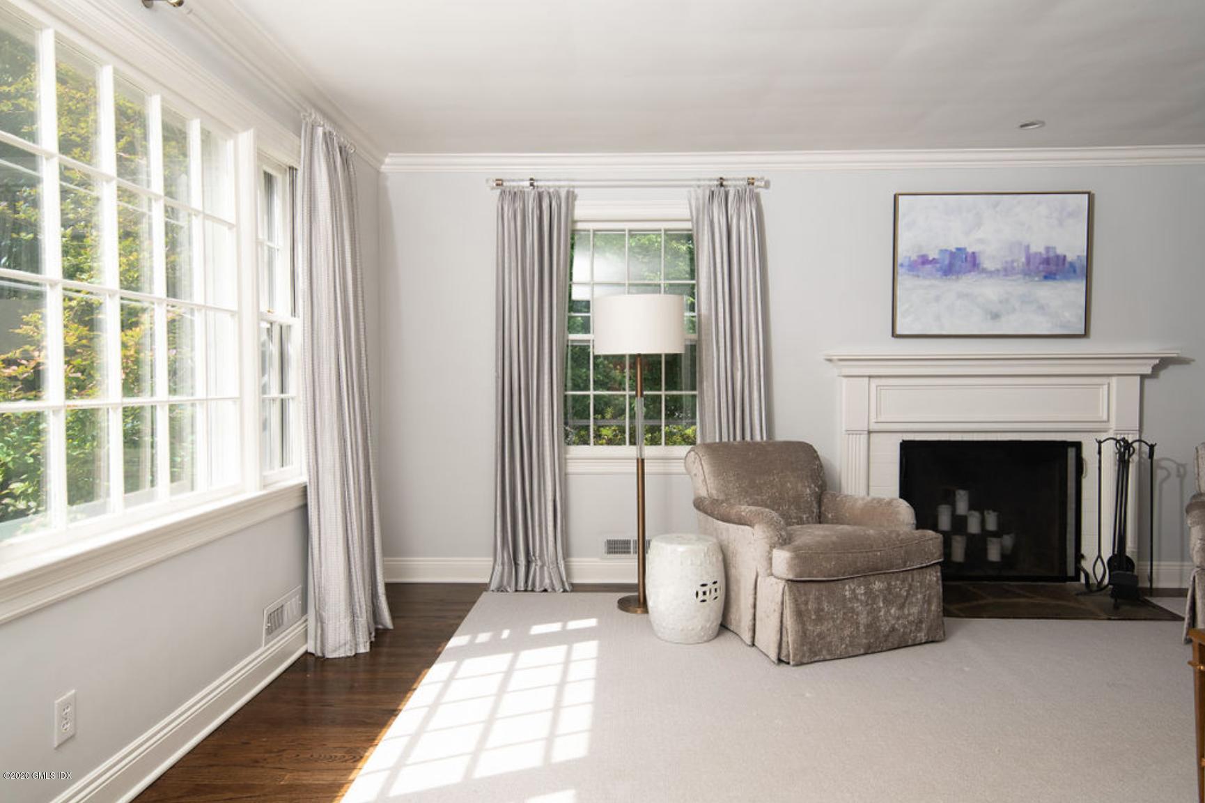 88 Birch Lane Greenwich, CT 06830 - Photo 11 of 33 a living room with furniture and a fireplace