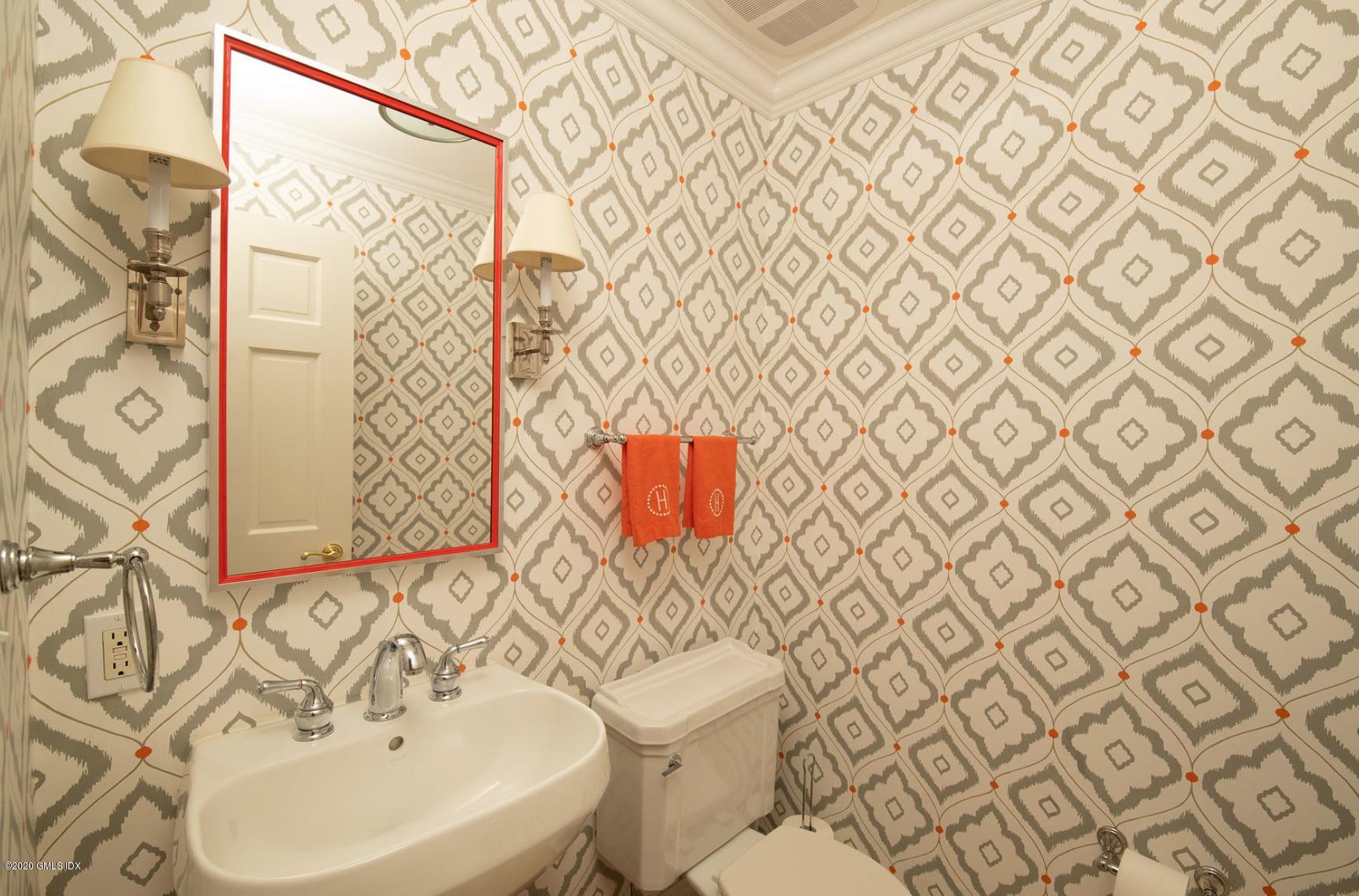 88 Birch Lane Greenwich, CT 06830 - Photo 14 of 33 a bathroom with a sink a toilet and shower curtain